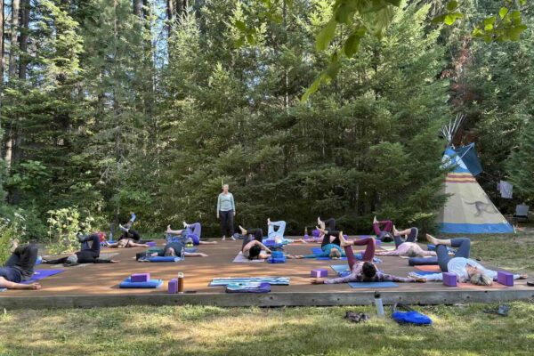 creekside yoga in the forest at a women's yoga retreat in Oregon