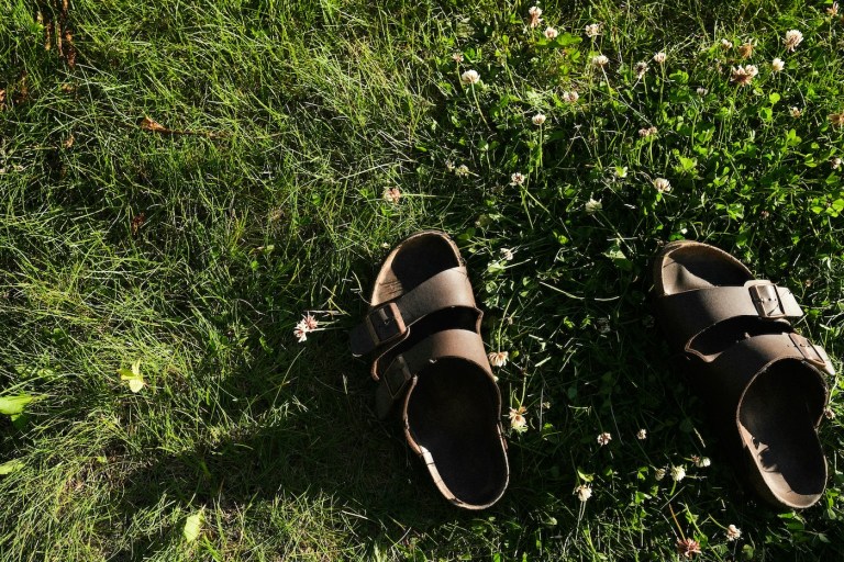 birkenstocks in the grass during women's yoga retreat in Oregon